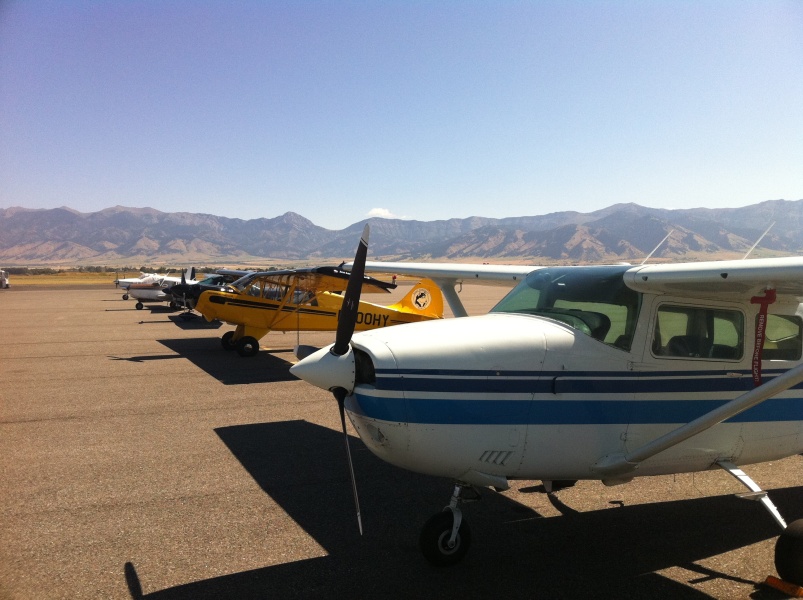 Scaled image N9513G and other aircraft on the BZN ramp with Bridger Range mountains.jpg 
